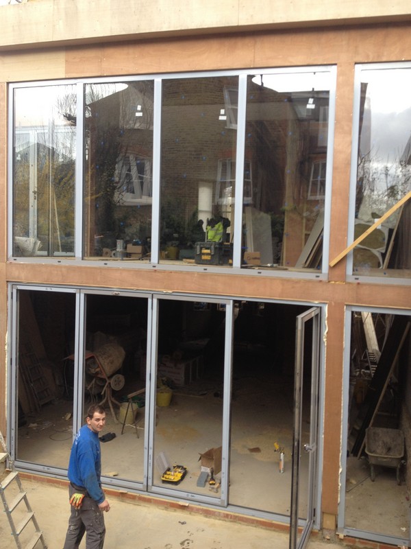 Aluminium bi-fold doors with two-storey glazing in Mitcham