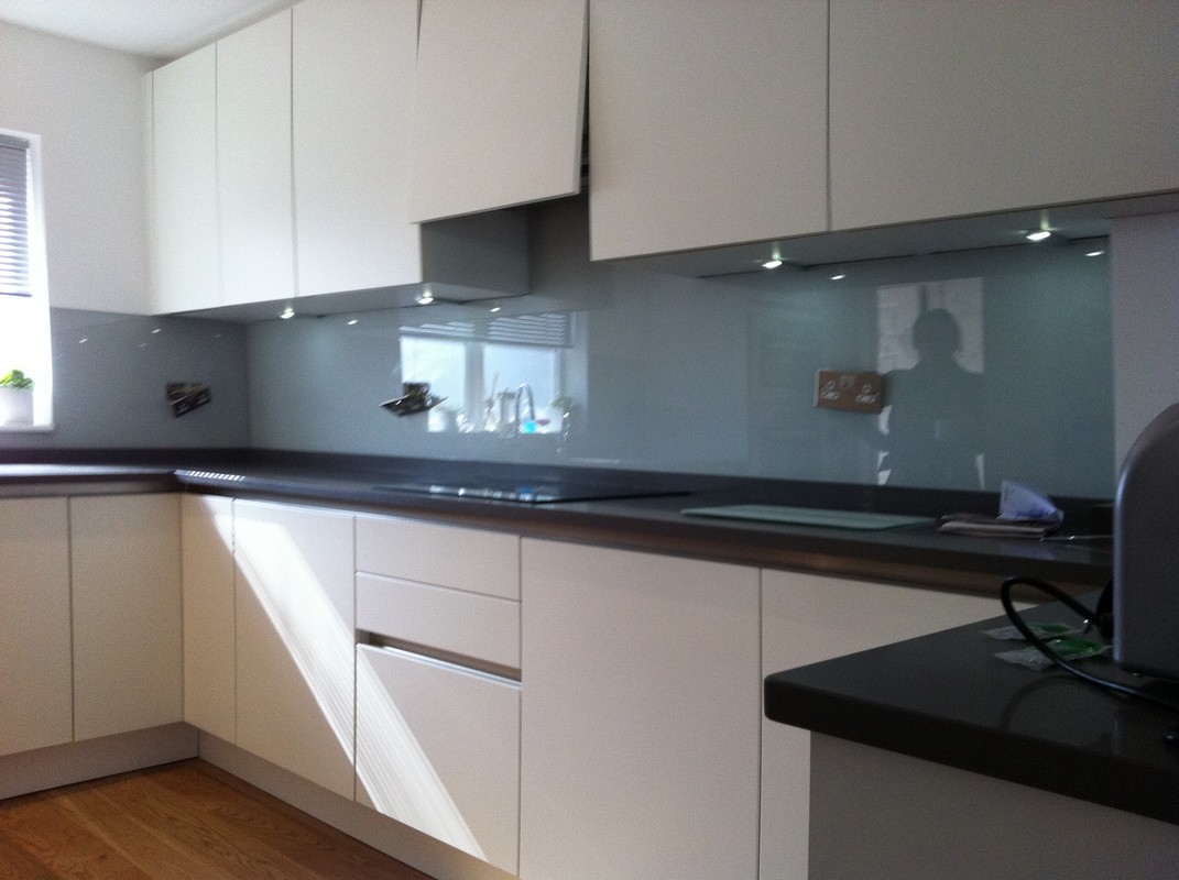 Grey glass kitchen splashback with LED lighting in Mitcham