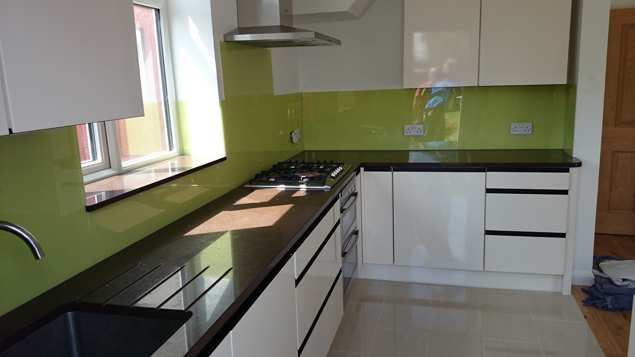 Lime green glass kitchen splashback installed by Mitcham glaziers