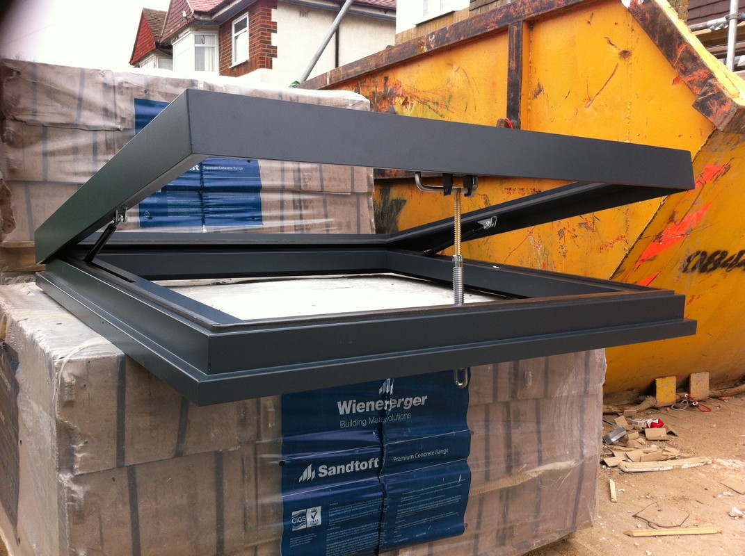 Opening flat roof skylight in anthracite grey installed in Mitcham