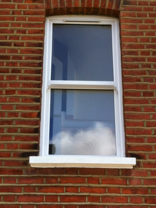 uPVC sash window on Victorian red brick house in Mitcham